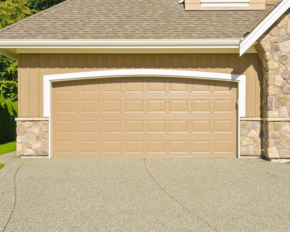 concrete-driveway-of-tan-house